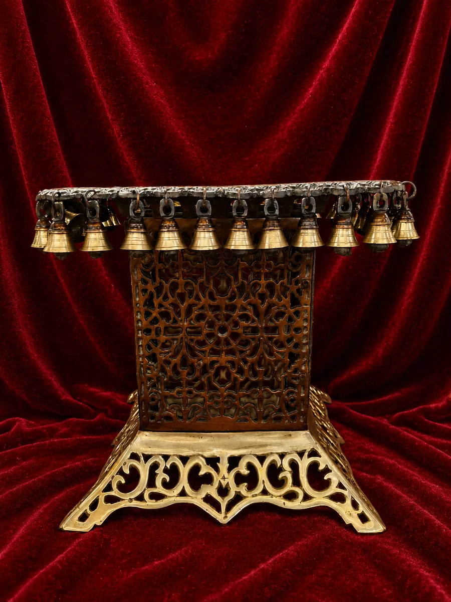 Brown square stand with bell